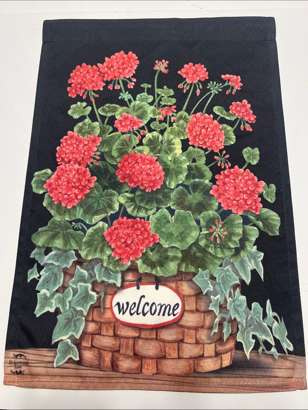 Welcome Geranium Basket Garden Flag - Black Background, Red & Green Floral